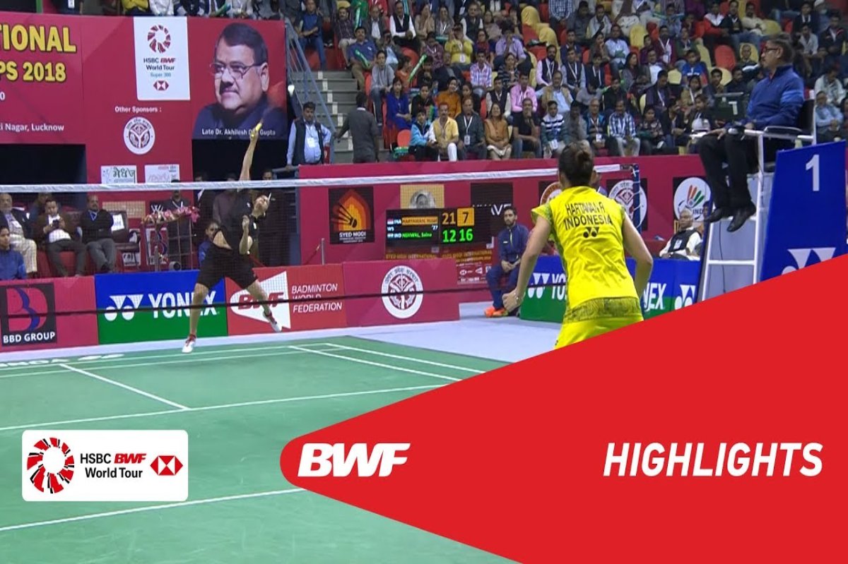 Volleyball team in action during a match with dramatic lighting